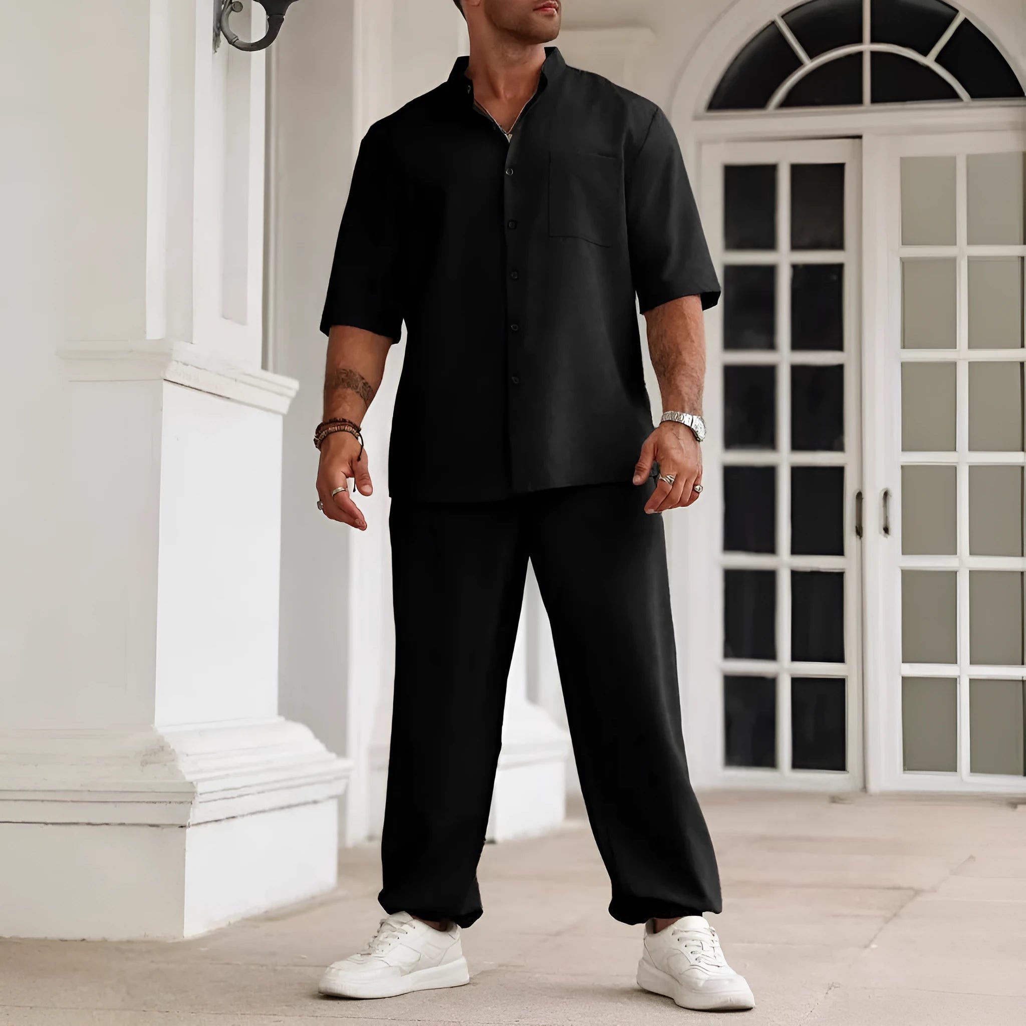 Men's apricot coloured cotton linen short-sleeved shirt jacket and trouser casual set laid flat.