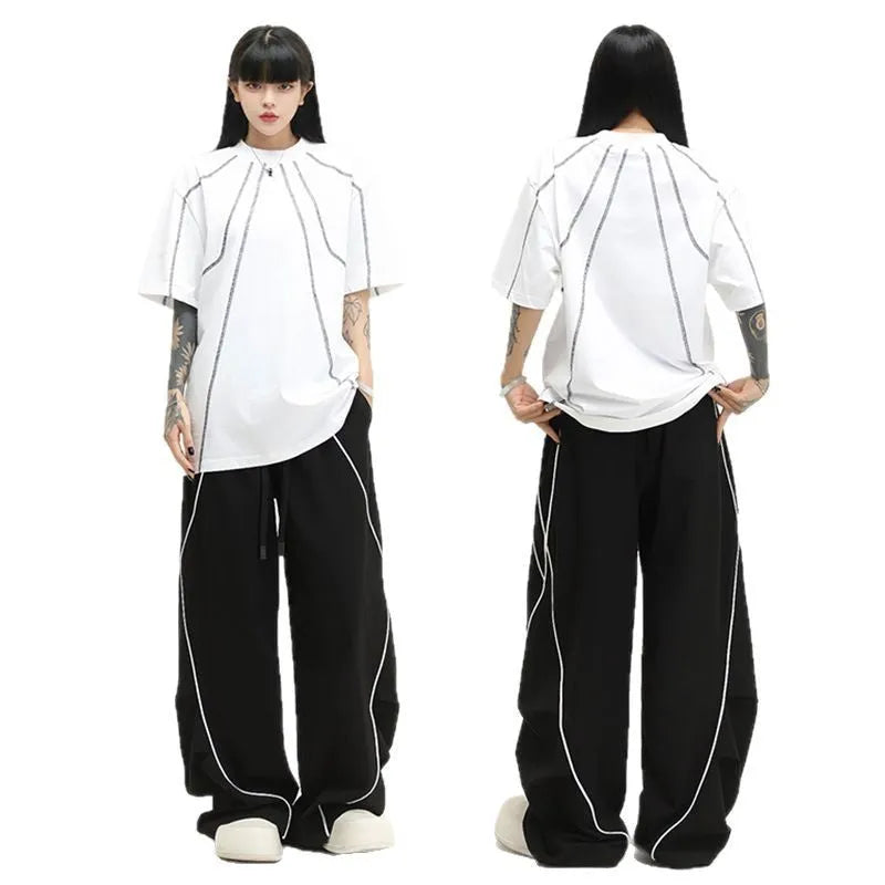 Black pleated wide-leg trousers with striped pattern for hip hop dance and streetwear
