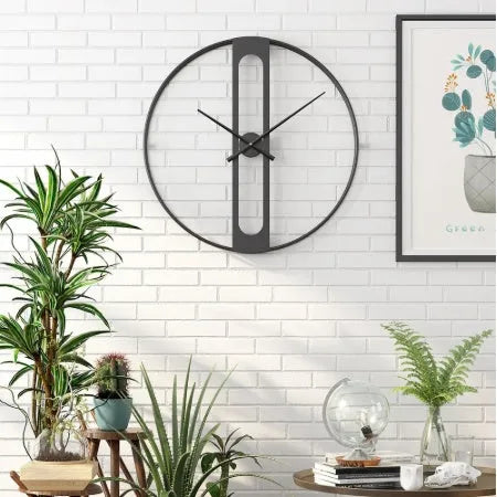Round metal wall clock with a 50cm diameter face in a choice of black or gold colour.