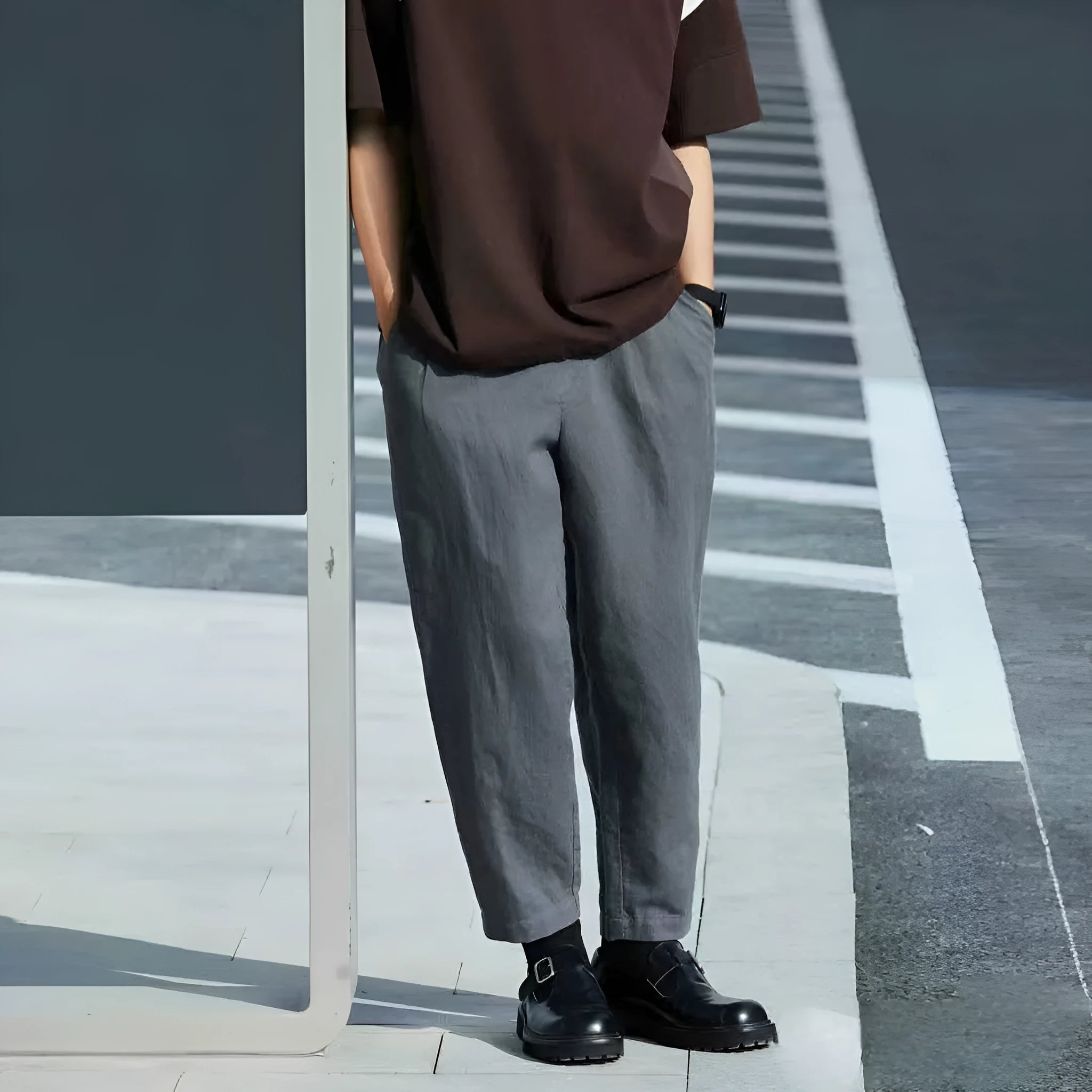 Men's loose straight leg casual trousers in beige with a drawstring waist and elasticated ankles.
