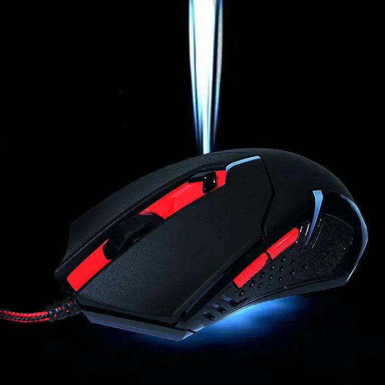Black and red USB wired optical computer mouse on a desktop