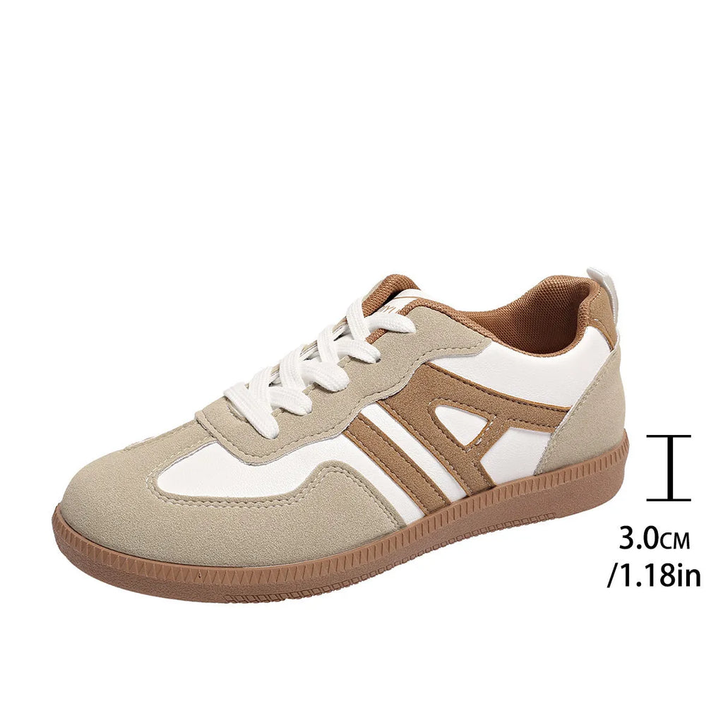 Women's retro colour matching lace-up jogging shoes in black with cross strap and low platform heel.