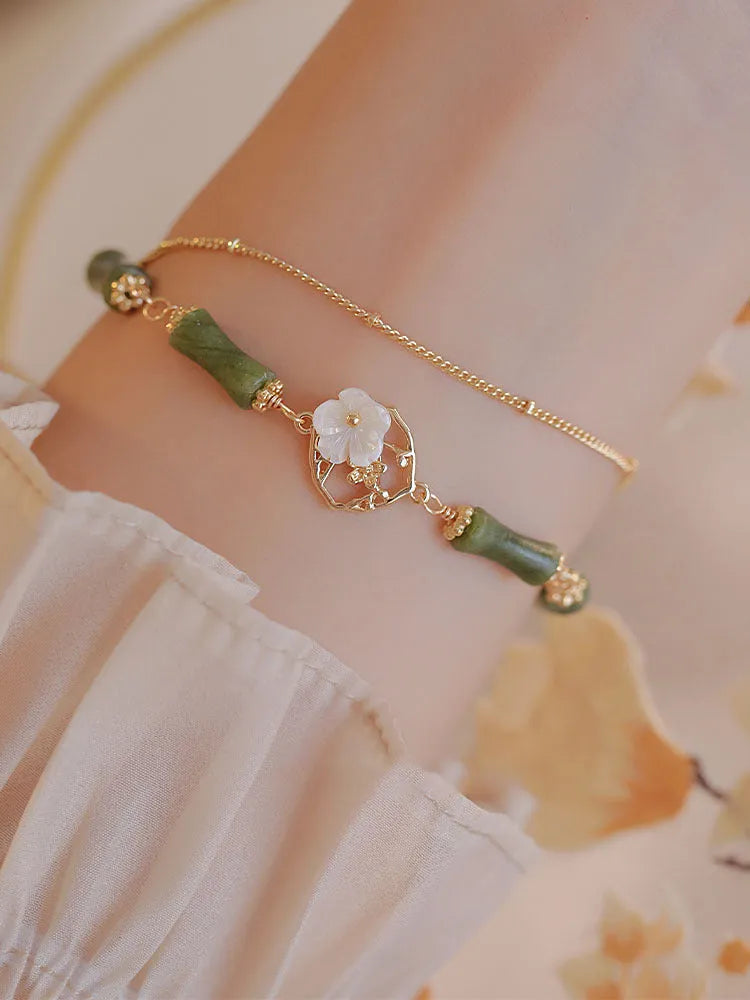 Natural green olivine bracelet with double layer design featuring olive branches and bells of Ireland motifs