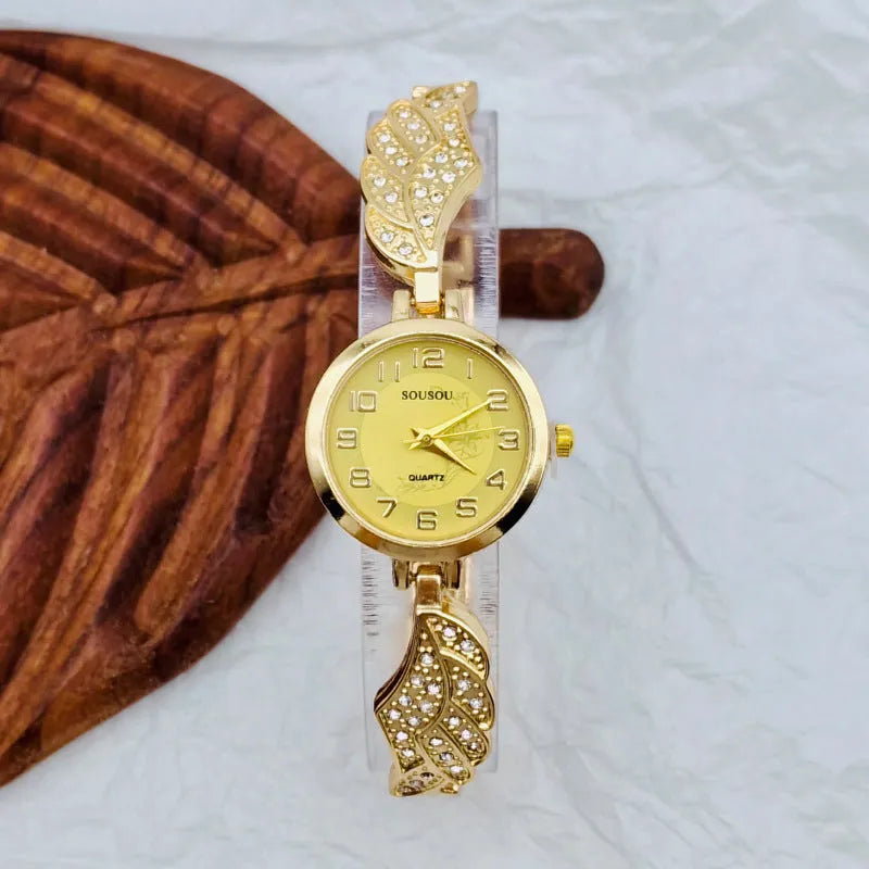 Women's stainless steel watch with a round dial shown in gold, black and gold, and white and gold colour options