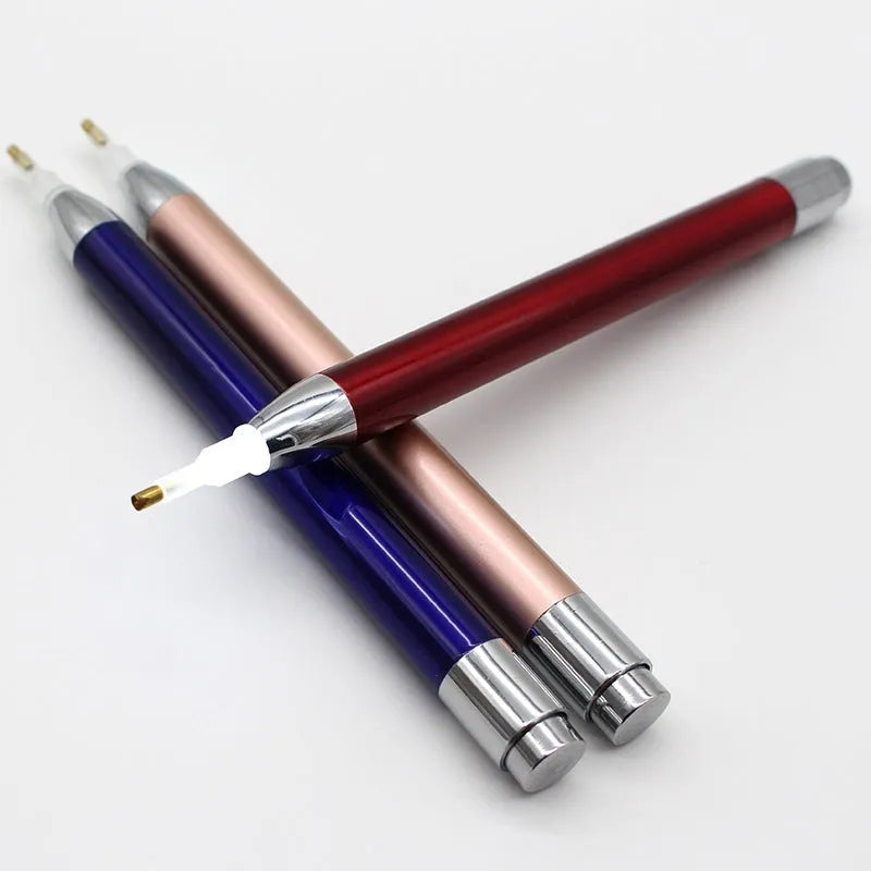 Luminous single-head diamond painting drill pen in gold, red, or blue with metal frame.