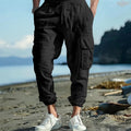 Men's linen trousers with ankle ties and multiple pockets in army green colour