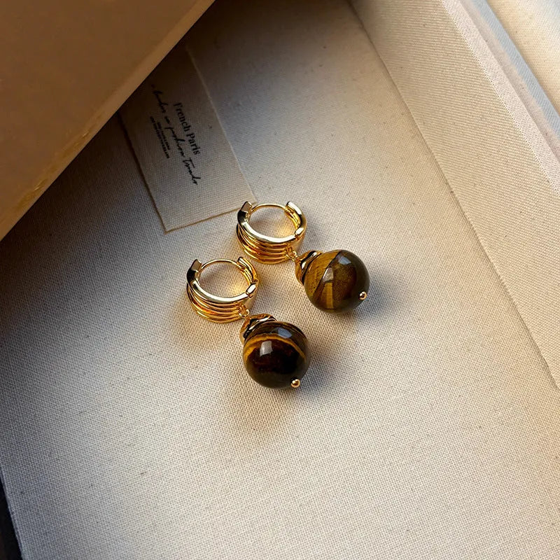 Geometric round tigereye stone earrings for women with gold plating in black and brown.