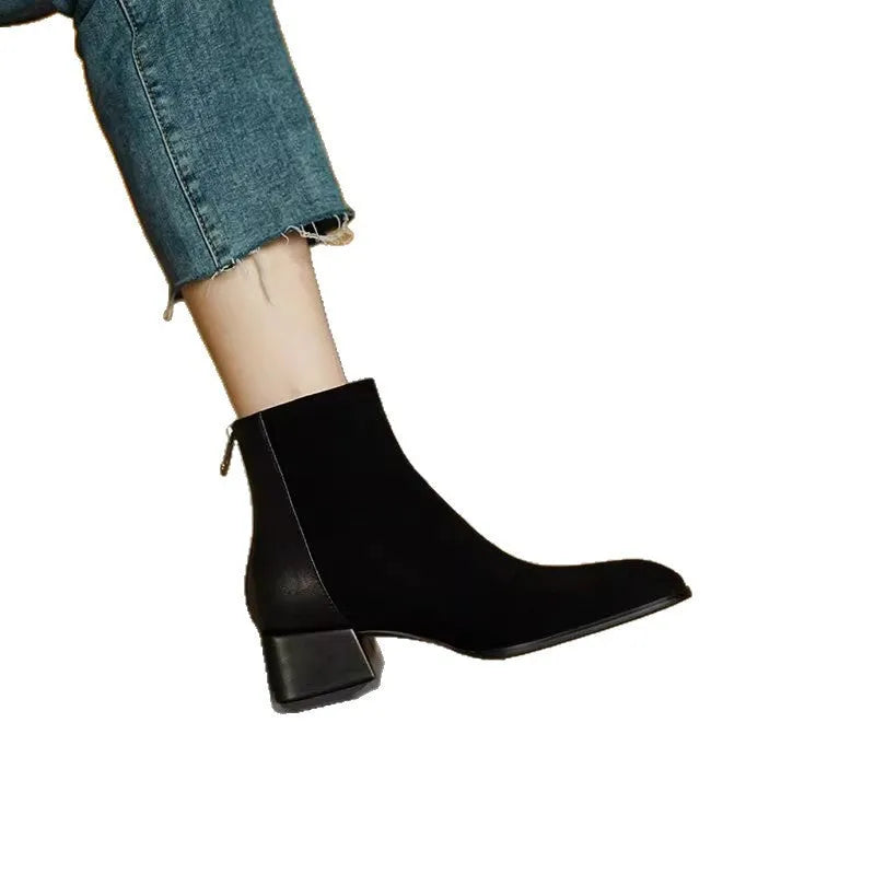 Women's suede martin boots in black with block heel and back zipper on a white background