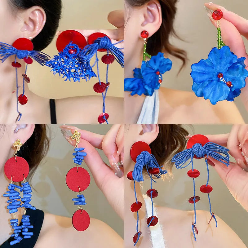 Women's handmade geometric cloth earrings with blue resin flower colour detail