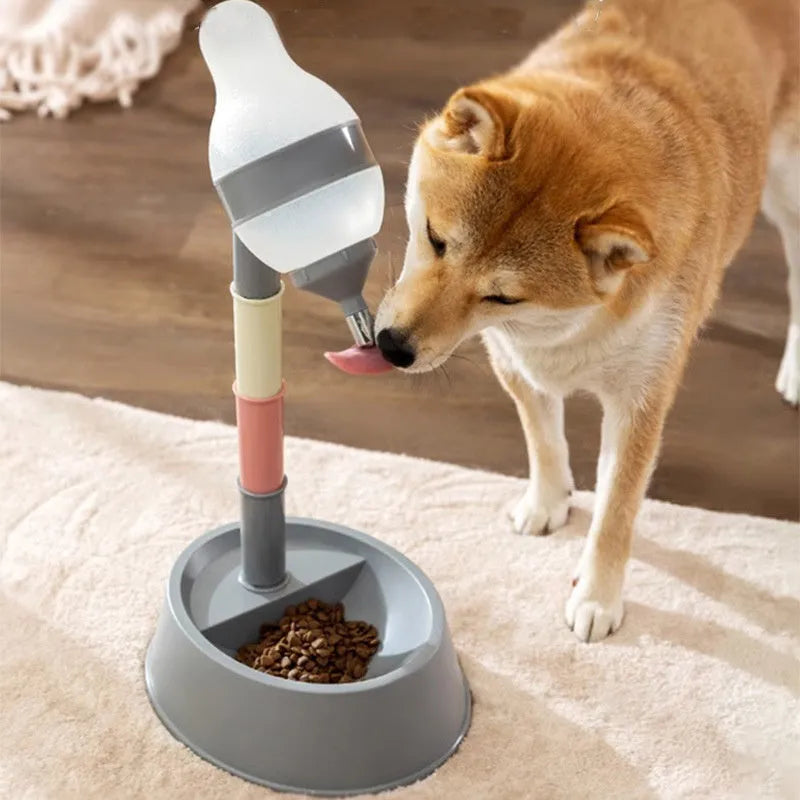 Green adjustable height pet water dispenser with detachable bowl and ball-tip nozzle on a kitchen floor.