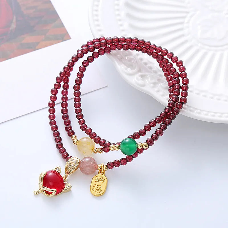 Natural garnet fox bracelet with adjustable rope closure in purplish red colour