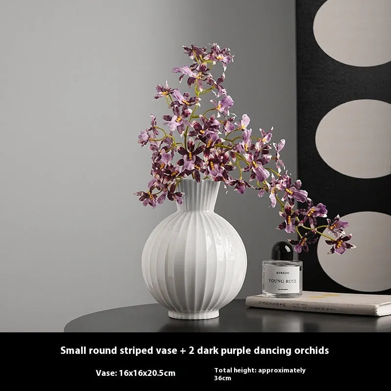 American country style ceramic vase with white base and blue stripes on living room table