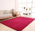 Soft white fluffy plush carpet with non-slip dot backing on a wooden floor