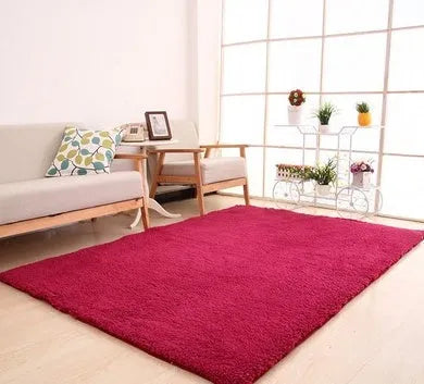 Soft white fluffy plush carpet with non-slip dot backing on a wooden floor