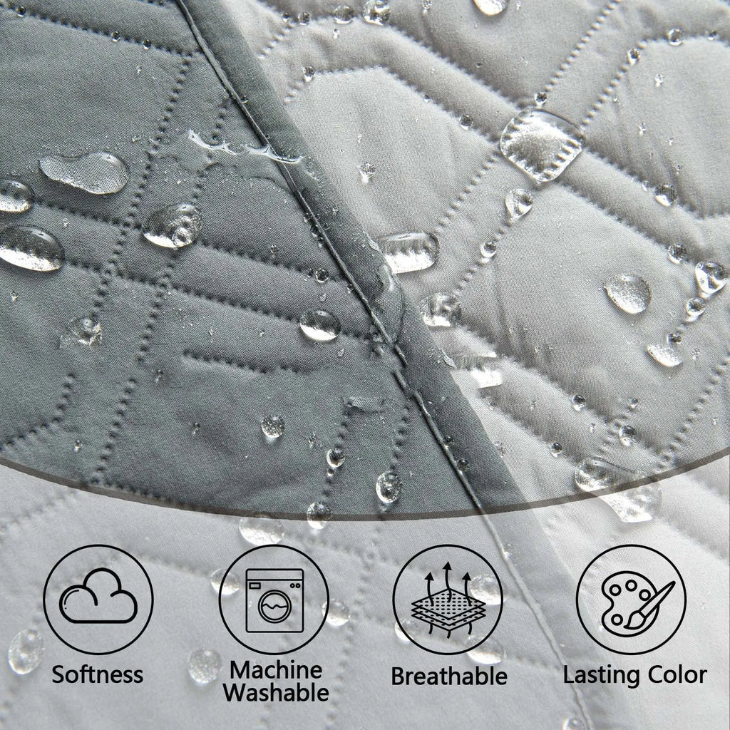 Reversible waterproof dog sofa cushion in dark grey and light grey, shown on a sofa.