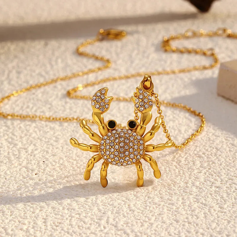 Gold electroplated stainless steel crab pendant necklace with diamond accents on regular chain, natural style