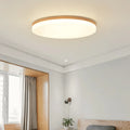 Japanese minimalist wood and acrylic LED ceiling lamp with a round acrylic shade on a wood body.