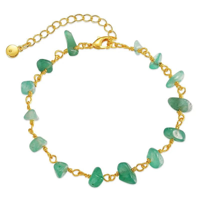 Irregular geometric gravel bracelet with crystal accents in 18K gold plated copper, showing blue colour option