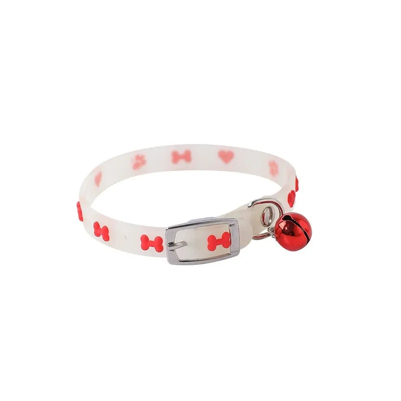Cat wearing luminous collar with adjustable 29cm silicone chain and metal bell in night setting