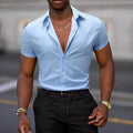 Light blue men's short-sleeved shirt with a floral print, showing the cardigan-style front and stretch fabric.