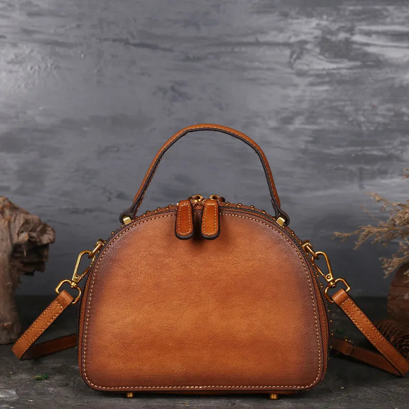 Vintage suede cowhide leather handbag showing interior mobile phone compartment, ID pocket, and laminated zipper pocket
