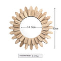 Circular wooden hanging mirror with a baked colour finish on a plain wall.