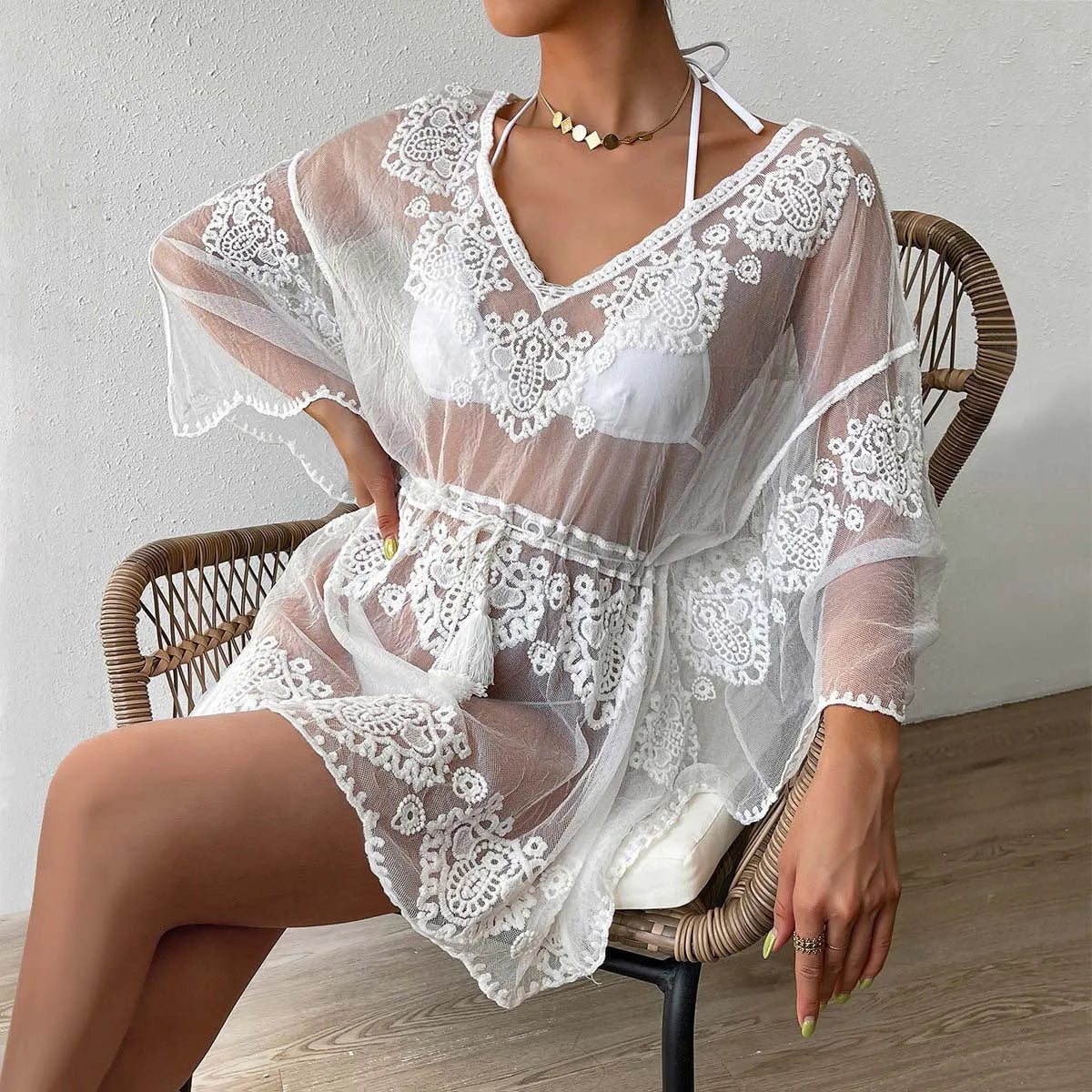 White water soluble polyester beach blouse for women on a free size mannequin.