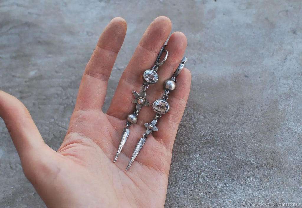 Geometric antique silver pendant earrings with XINGX rhinestone design
