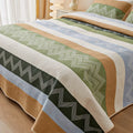Pure cotton floral printed bed sheet and pillowcases laid flat on a bed.