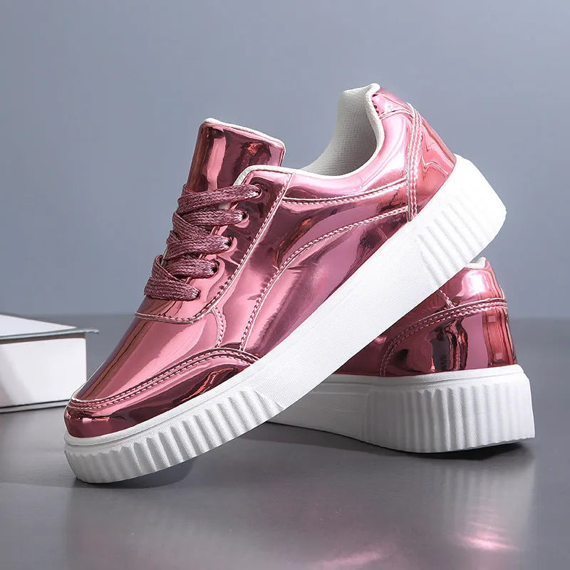 Gold sequinned unisex platform sneaker with thick sole and stitching detail on a white background.