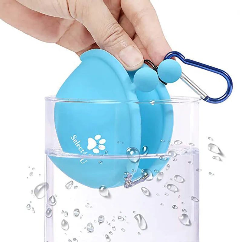 Yellow silicone dog training treat pouch with hook and loop closure on a waistband.