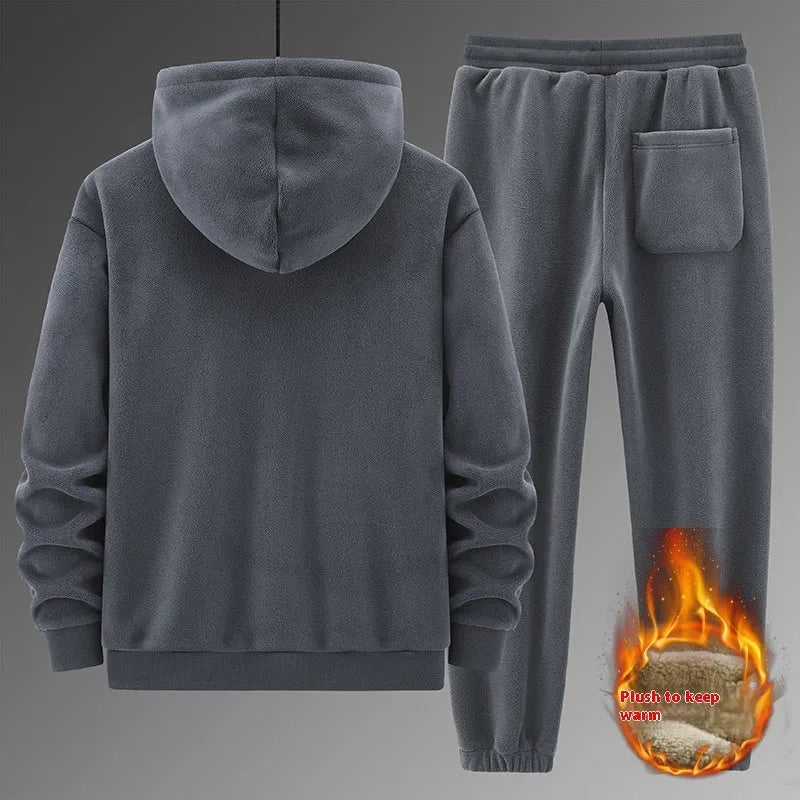 Grey cashmere-blend hooded sweater and matching trousers men's sports suit set on a hanger.