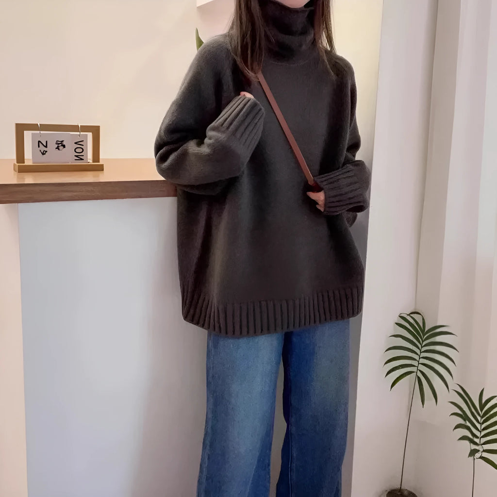 Women's loose turtleneck sweater in thick polyester mesh with curling pile collar, shown in solid colour.