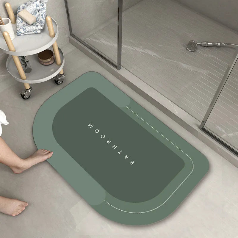Bathroom floor mat in blue colour, oval shape, showing machine-woven blended texture
