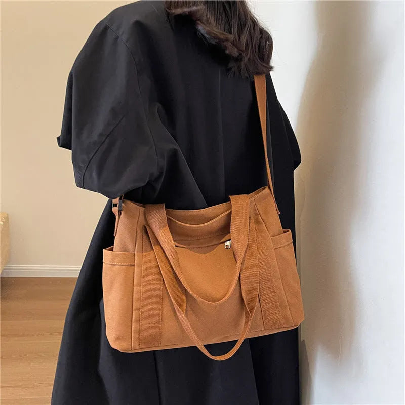 Women's solid colour shoulder bag with large capacity and mobile phone compartment in four colour options