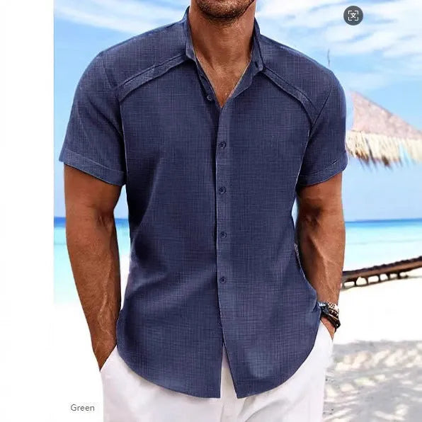 Man wearing a solid colour short sleeve Hawaiian casual shirt in a cotton blend fabric.