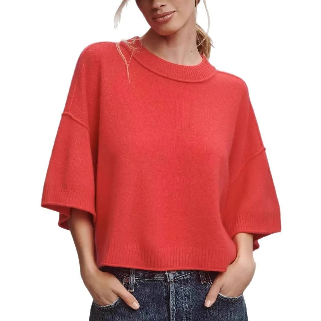 Red cropped viscose T-shirt with an exposed navel design on a mannequin, showing the short length and regular sleeves.