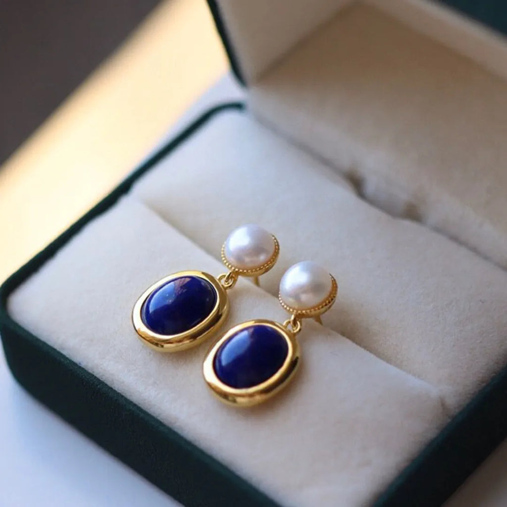 A pair of simple lapis lazuli pearl dangle earrings in 925 sterling silver with auspicious patterns.