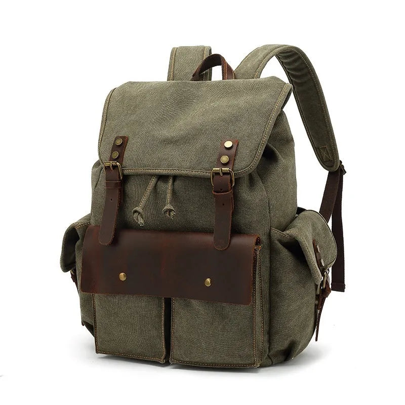Retro military green canvas backpack with antique bronze hardware, shown with a laptop.