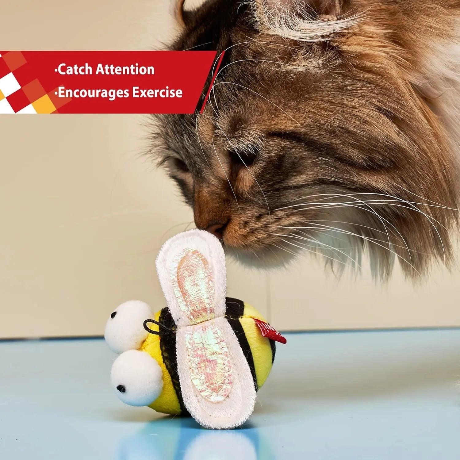Yellow bee-shaped electronic cat toy with flannelette fabric on wooden surface