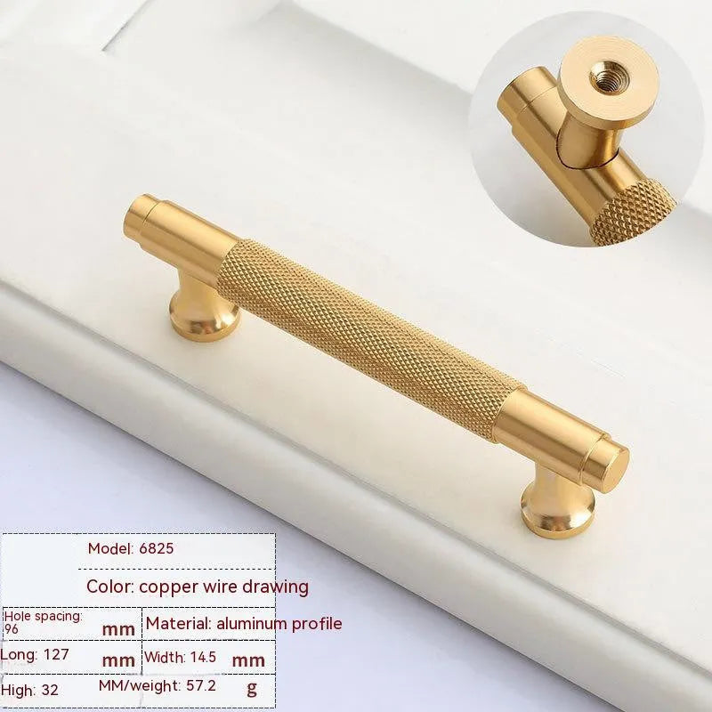 Aluminium furniture handle with brushed brass finish showing European style design