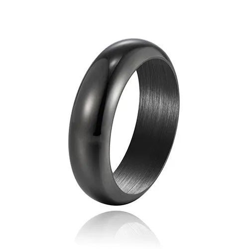 Glossy electroplated titanium steel ring in gold colour on a plain background.