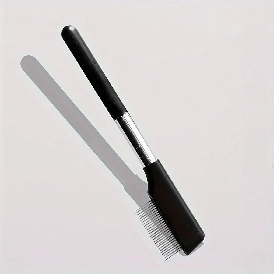 Black pet grooming brush with soft silicone bristles for eye cleaning and comb attachment for hair removal