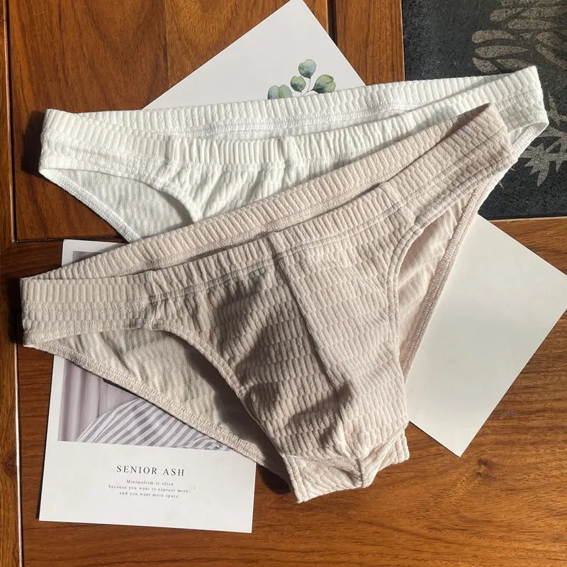 Men's solid colour cotton triangle underwear briefs with a mid waist design.