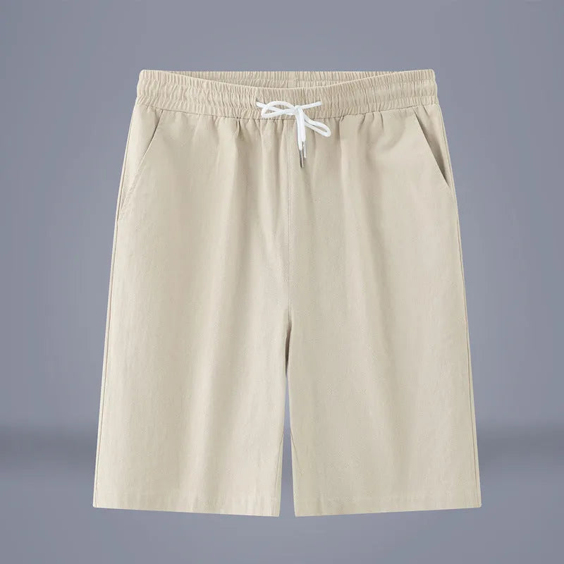 Solid colour cotton linen cropped summer pants on a hanger, showing mid-waist and drawstring detail.