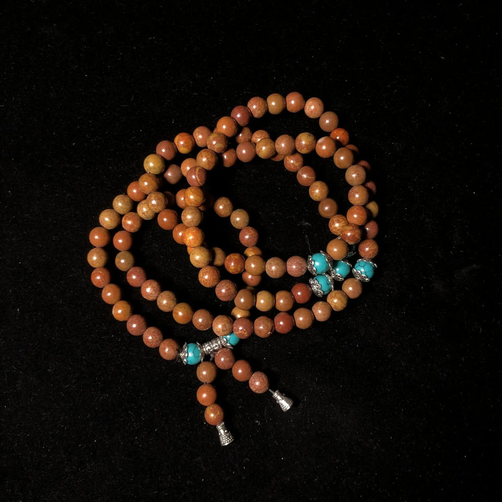 Hand-polished Lvzhu stone bracelet with 108 geometric beads measuring 5-6mm diameter