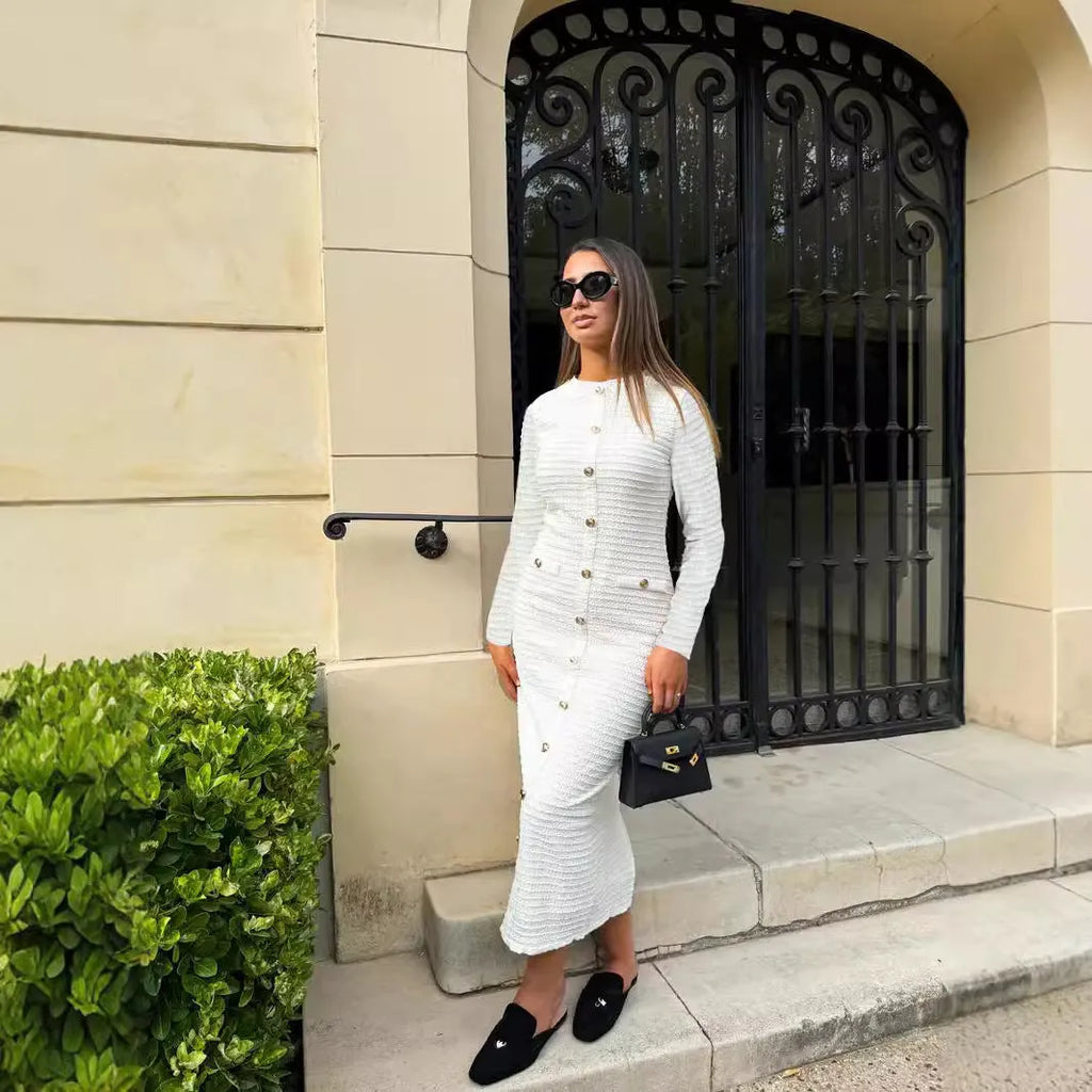Black and white French retro slim fit knitted long-sleeved dress with button details.