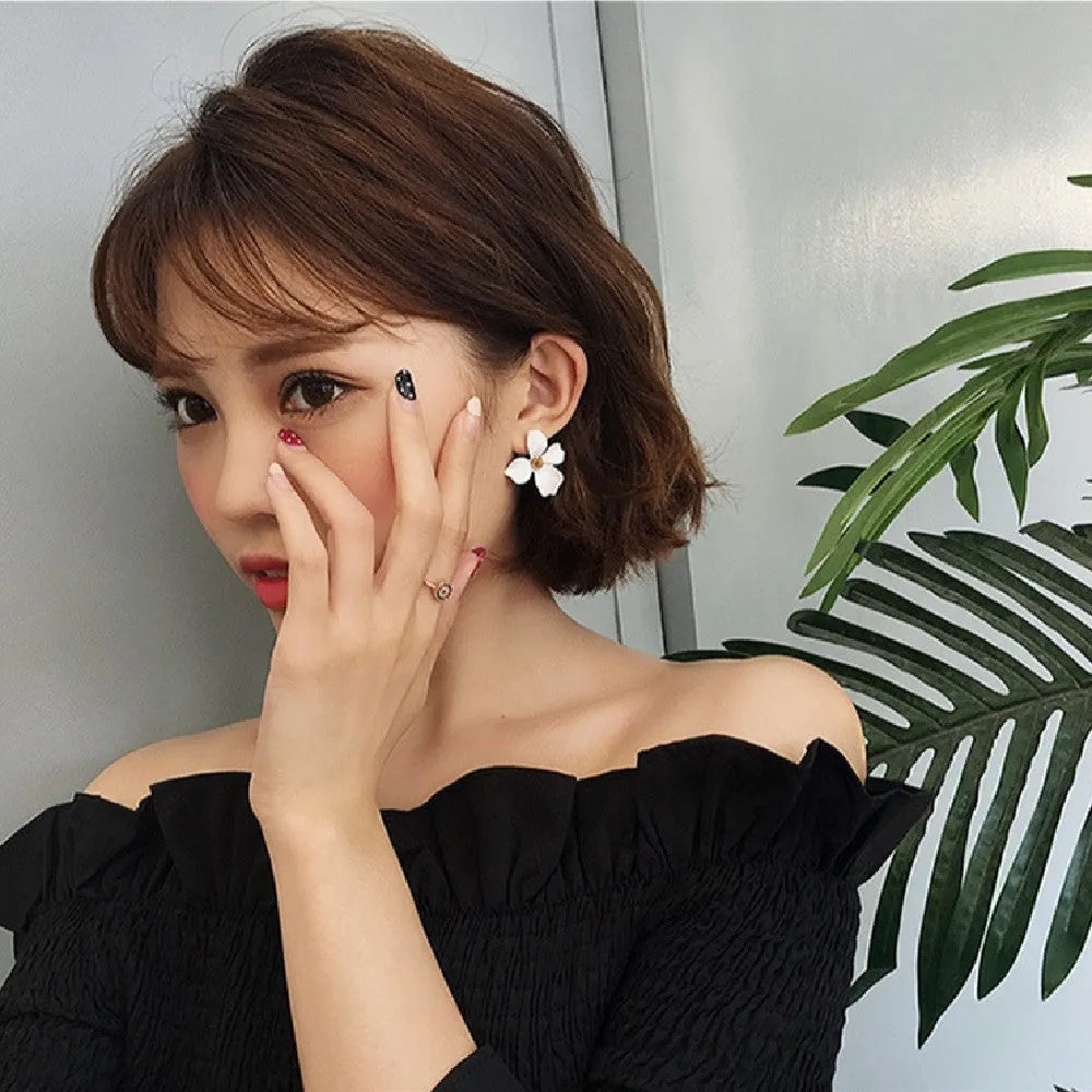 Flower stud earrings for women in pink and white colour options with electroplated alloy construction