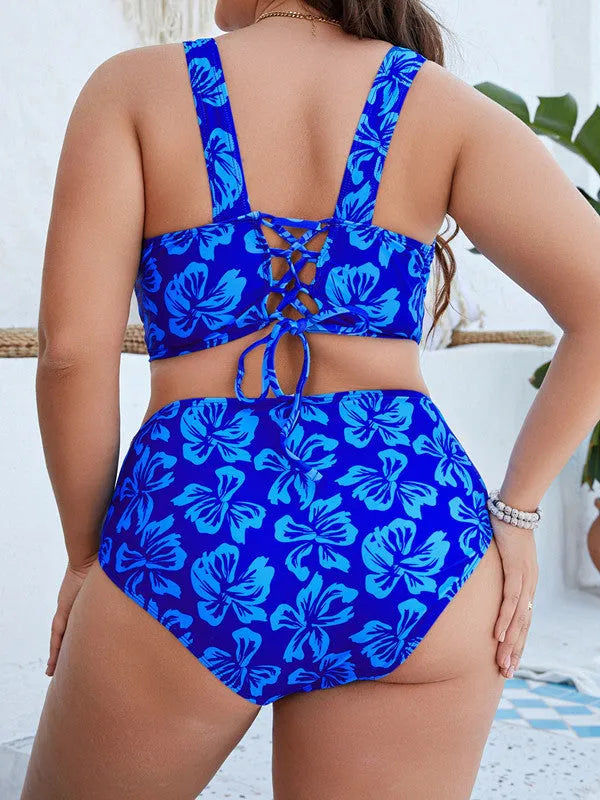 Blue floral print women's two-piece bikini swimsuit on a hanger.