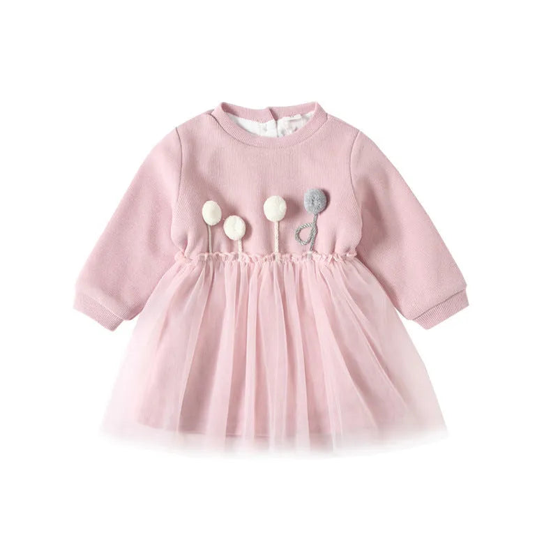 Baby girl pink velvet dress with long sleeves and mesh overlay, front view, sitting pose